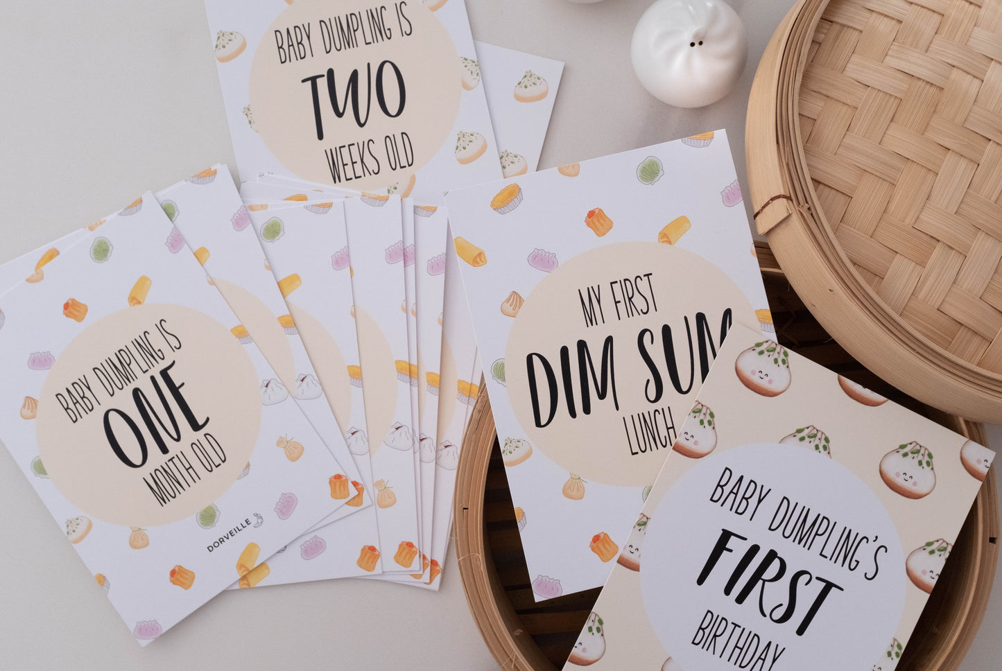 Dim Sum inspired baby milestone cards in a steamer basket