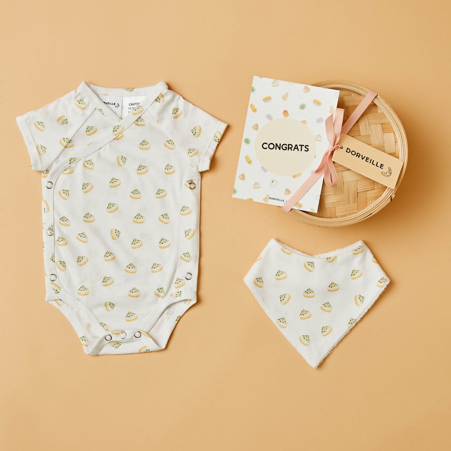 Dumpling inspired baby bodysuit, matching bib, Congrats postcard and a Bamboo Steamer Basket with pink ribbon
