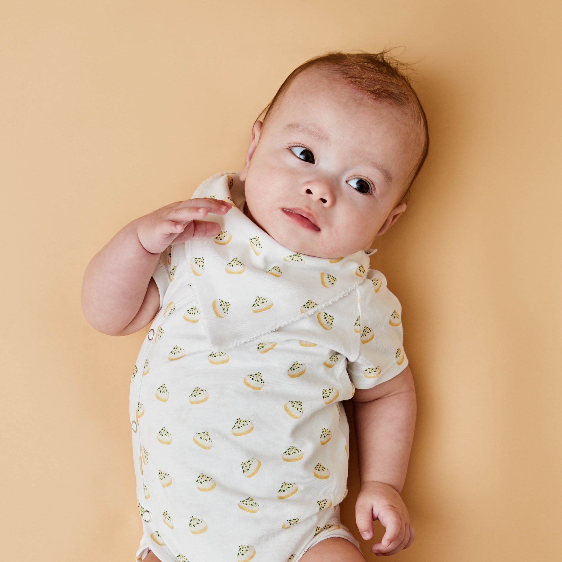 Baby with dumpling inspired bib and baby bodysuit 