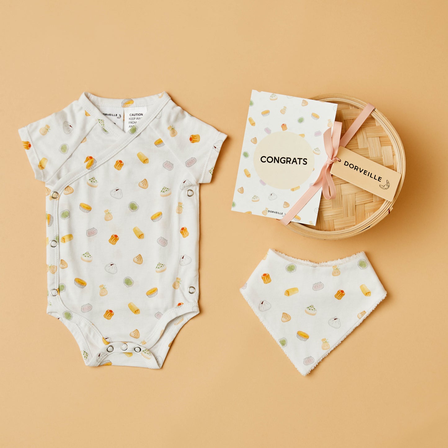 Colourful dim sum inspired baby bodysuit, matching bib, Congrats postcard and bamboo steamer basket gift box
