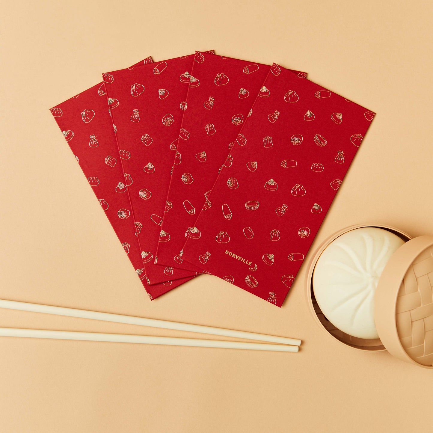 Lunar New Year Lucky Red Envelopes with Dim Sum print in gold foil. Decorations of a steamer bun and chopsticks